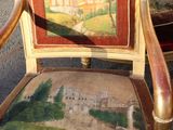 a painting on the back of a chair with a picture on it
