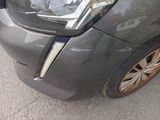 a close up of a car ' s headlight and front bumper