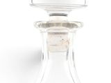 a glass bottle that has a stopper on the top of it