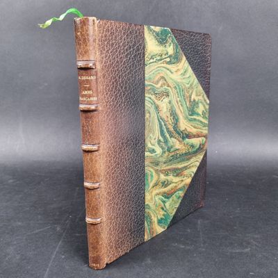 a close up of a book with a green and brown cover