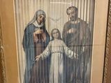 painting of a religious scene of jesus and his family in a gold frame