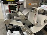a machine that has a roll of paper on it