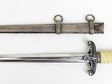 an old knife and a small knife on a white surface