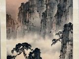 chinese painting of mountains and clouds in the sky above them