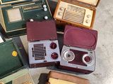 many different types of old fashioned radio sets on the floor