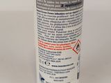 a close up of a bottle of lotion on a white surface