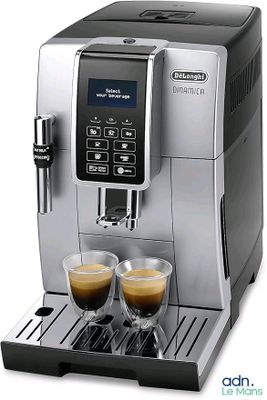 a close up of a coffee machine with two cups of coffee