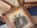 a person holding a picture of a woman in a dress