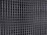 a close up of a black and white photo of a wire fence