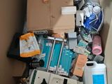 a cardboard box filled with assorted items in it