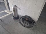 a fire extinguisor and a hose on the floor