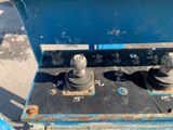 a close up of a blue machine with two different knobs on it