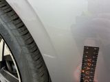 a sticker on the side of a car with a ruler attached to it