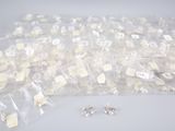 a lot of small bags of jewelry sitting on a table
