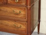 a marble top dresser with a mirror on top
