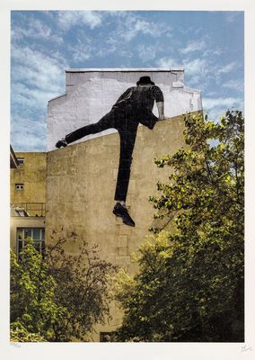 an image of a man on a skateboard in the air above a building