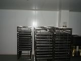 a room with a bunch of racks of food in it