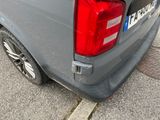 a grey van parked on the side of the road