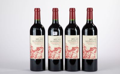 trois bouteilles de vin rouge posées côte à côte sur une table