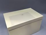 an image of a white box with a lid on a grey background