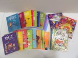 a lot of children ' s books that are on the table