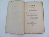 an old book opened to a page with a picture of the title