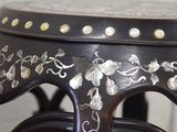 a wooden table with a black and white design on it