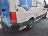 a blue and white van parked on the side of the road