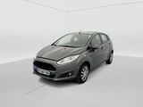 a grey ford fiesta parked in a white room