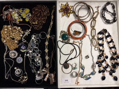 a lot of necklaces and bracelets that are in a box