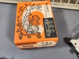 a box with a picture on it next to a pair of scissors and a pair of scissors