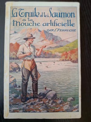an old book with a picture of a man fishing on a river