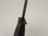 a close up of a metal object on a white surface