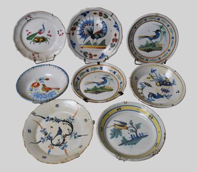 nine plates with different designs on them on a white surface