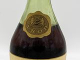 bottle of liquor sitting on a white surface with a white background