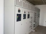 a room with a bunch of electrical equipment in it