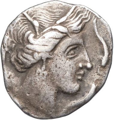 a close up of a coin with a woman ' s face on it