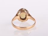 an image of a gold ring with a stone in the center