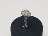 an image of a diamond ring on a black velvet ring holder