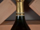 a bottle of wine that is sitting on a table