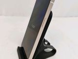 a cell phone that is sitting on a stand