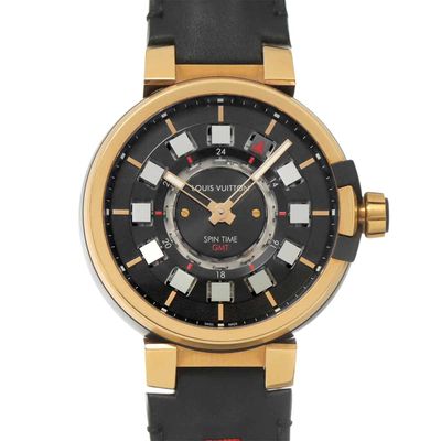 the black and gold watch has a black dial and a black leather strap