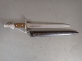 a knife that is laying on top of a table