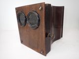 a small wooden box with two speakers on it