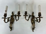 pair of antique brass wall sconces with frosted glass shades