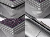 three silver purses with purple and black glitters on them