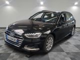 a black audi parked in a garage with a checkered floor