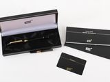 the pen is in a black box with a gold trim