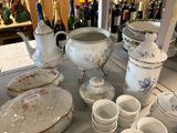 a table with a lot of china on it