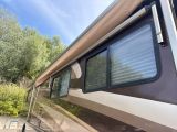 a motor home that is parked on the side of the road